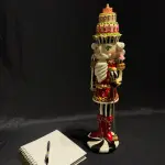 Nutcracker Statue with Layered Cake Design
