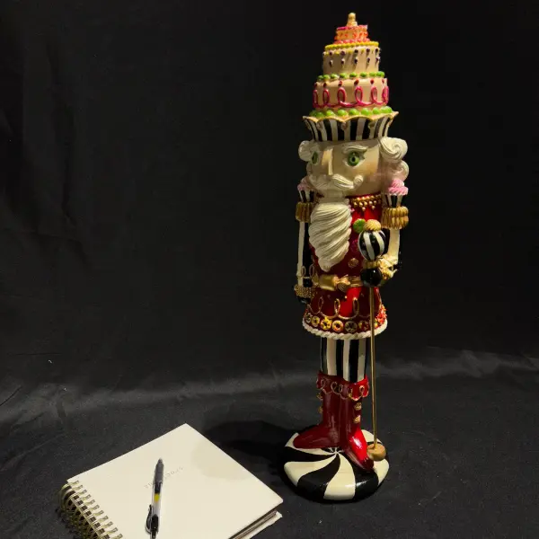 Nutcracker Statue with Layered Cake Design