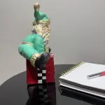 Ferozzi Playful Green Santa on Gift Box Figurine – Handcrafted Whimsical Holiday Decor