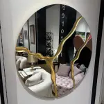 Ferozzi  Round Mirror with Gold Abstract Detailing | Modern Decorative Wall Mirror