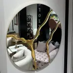 Ferozzi  Round Mirror with Gold Abstract Detailing | Modern Decorative Wall Mirror