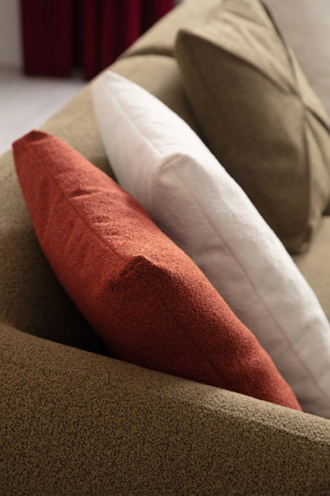 Cardea olive green sofa with decorative pillows detail – Ferozzi